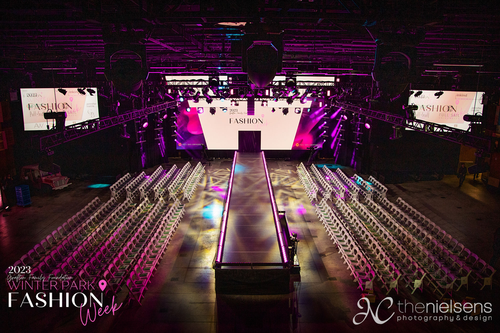 The runway and stage lit before guests arrive