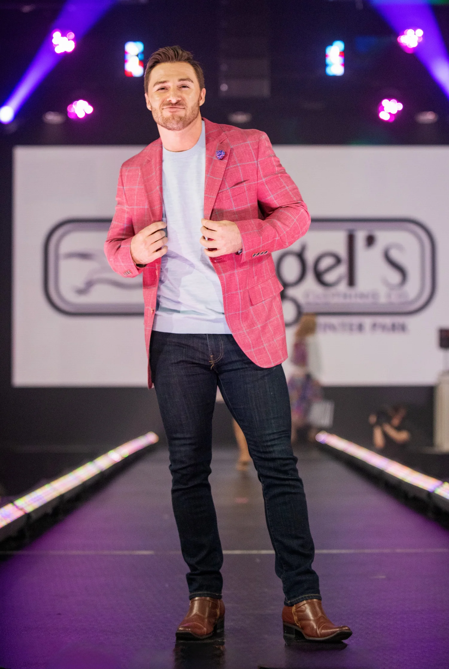 Model in a pink jacket on the runway